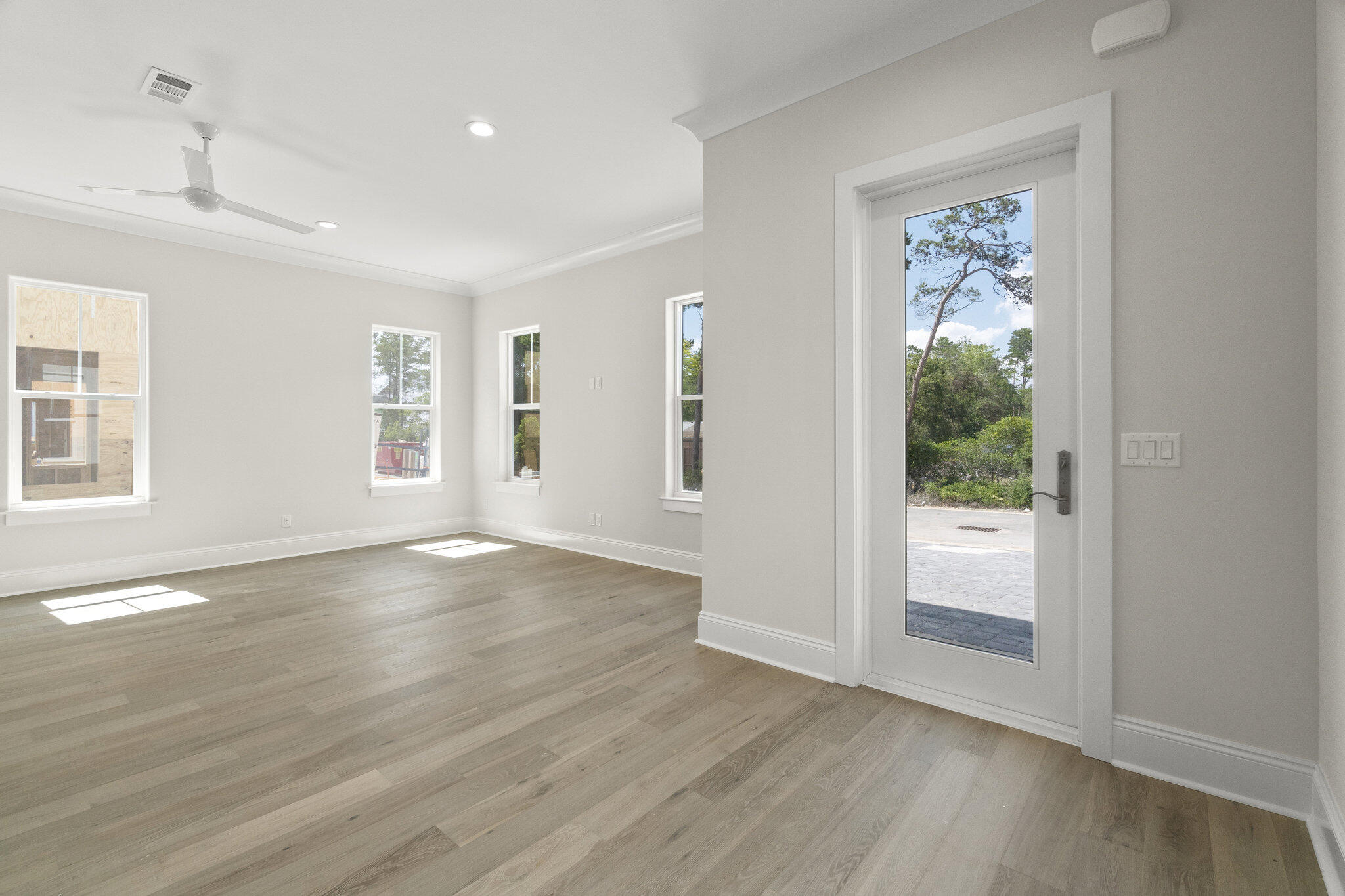 25 Sunset Key Inlet Beach, FL 32461 - Photo 4 of 32 a view of an empty room with wooden floor and a window