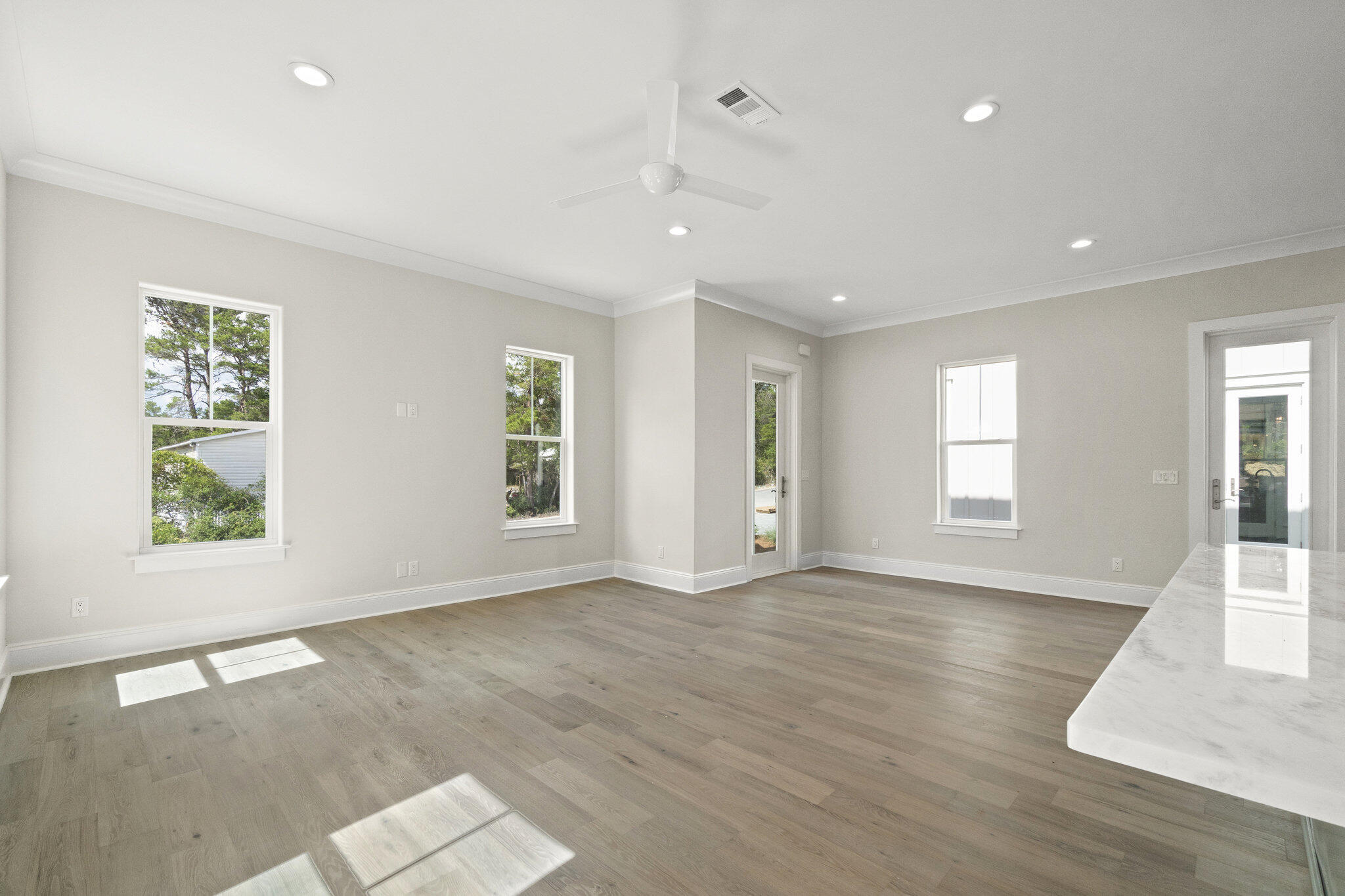 25 Sunset Key Inlet Beach, FL 32461 - Photo 10 of 32 an empty room with wooden floor and windows