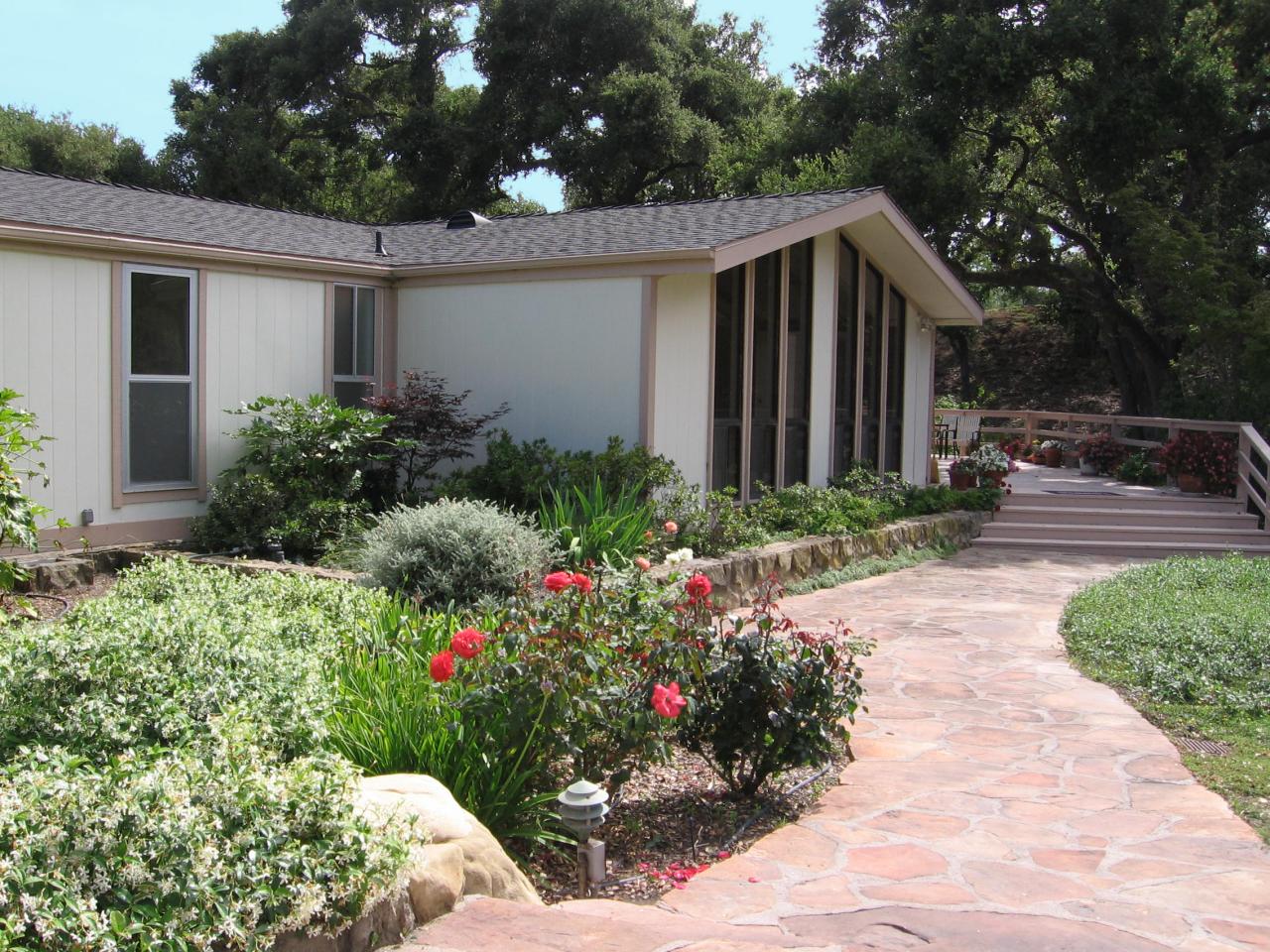 340 Old Mill Road, Unit 181 Santa Barbara, CA 93110 - Photo 1 of 20 a view of a house with wooden walls and flower plants