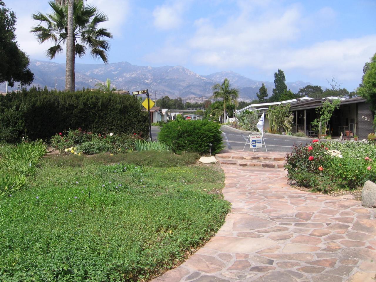 340 Old Mill Road, Unit 181 Santa Barbara, CA 93110 - Photo 15 of 20 a front view of a house with a yard and mountain view in back
