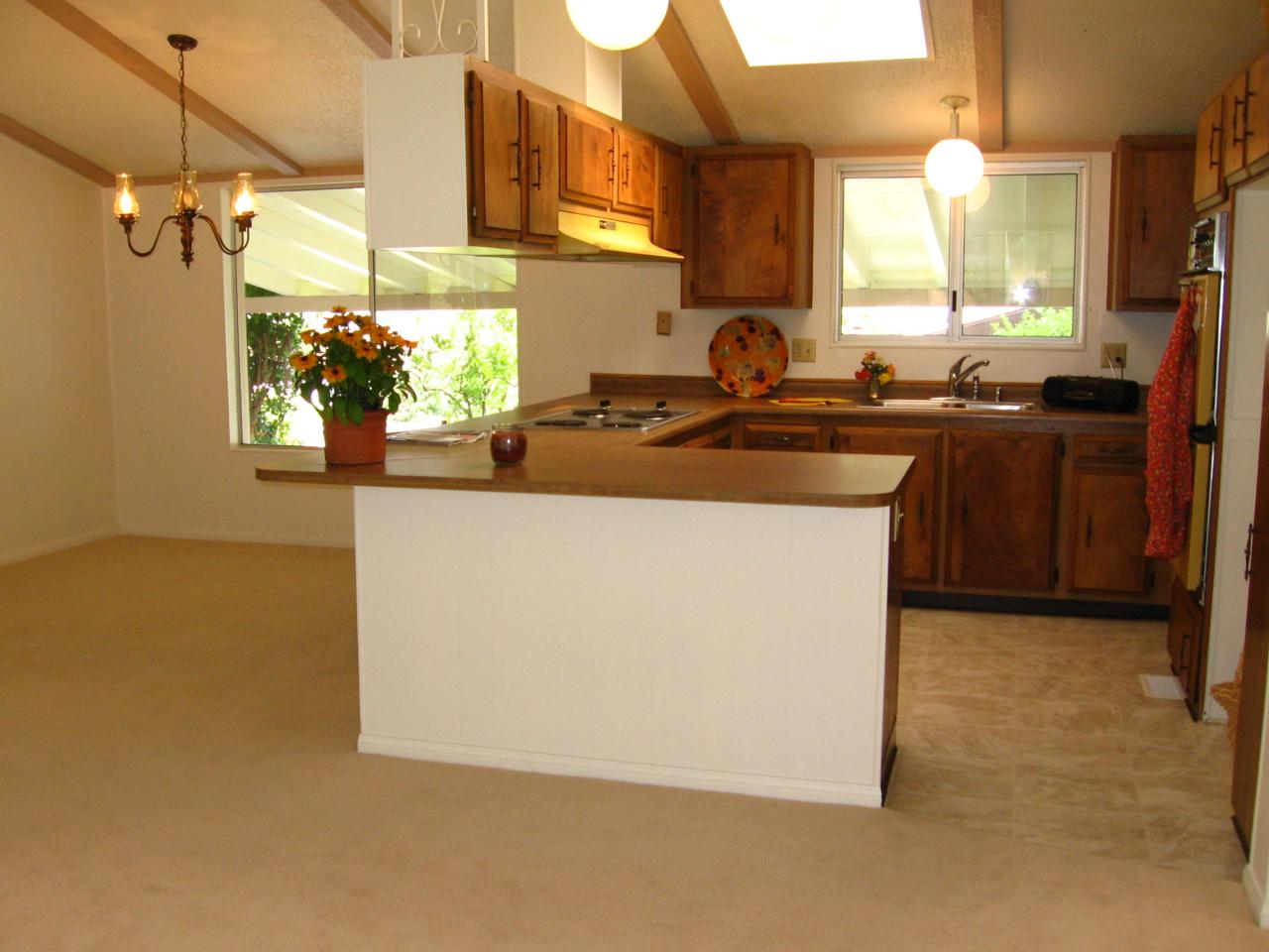 340 Old Mill Road, Unit 181 Santa Barbara, CA 93110 - Photo 3 of 20 a kitchen with stainless steel appliances granite countertop a sink a stove and a refrigerator