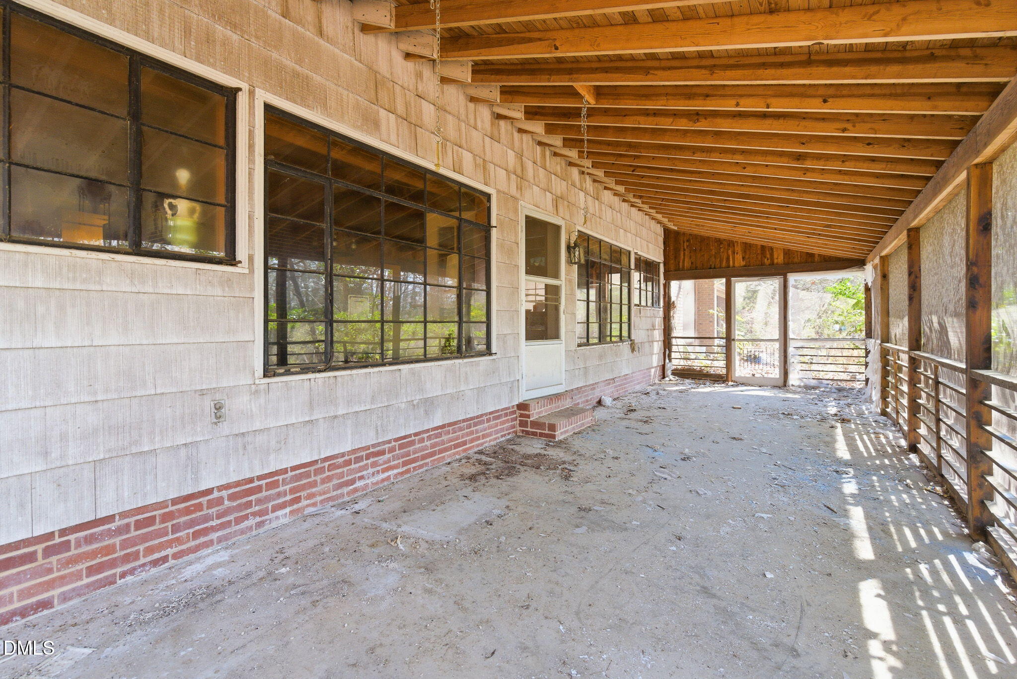 1603 Sykes Road Mebane, NC 27302 - Photo 10 of 45 a view of a porch with a table and chairs