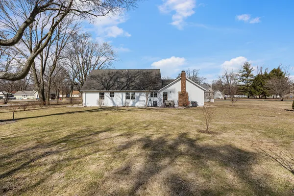 a house with trees in the background