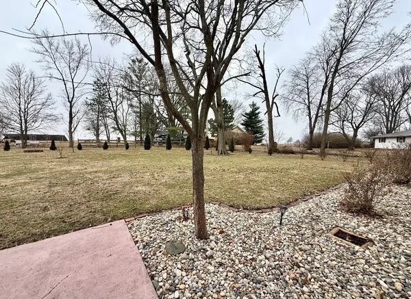 a backyard of a house with lots of green space