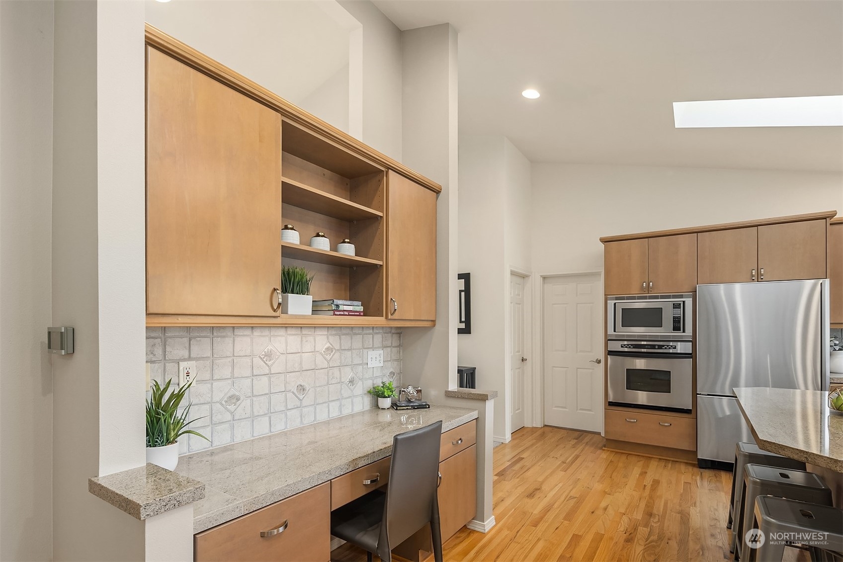 11302 East Riverside Drive Bothell, WA 98011 - Photo 11 of 37 a kitchen with a refrigerator and a sink