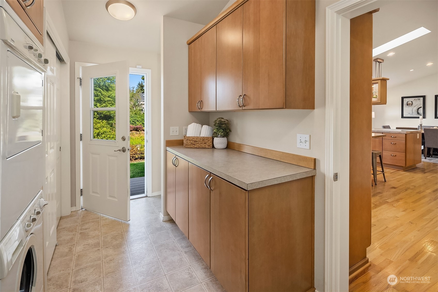11302 East Riverside Drive Bothell, WA 98011 - Photo 22 of 37 a kitchen with a sink and a refrigerator