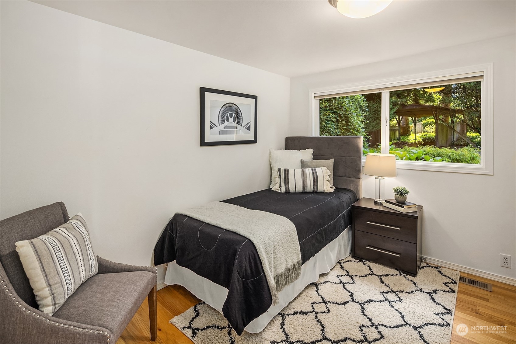 11302 East Riverside Drive Bothell, WA 98011 - Photo 23 of 37 a bedroom with a bed and a window