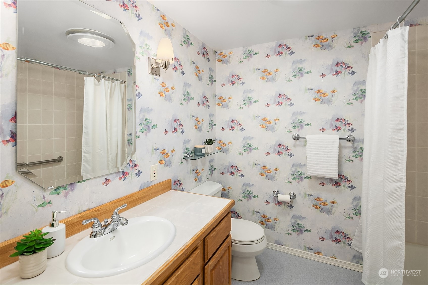 11302 East Riverside Drive Bothell, WA 98011 - Photo 24 of 37 a bathroom with a sink toilet and shower