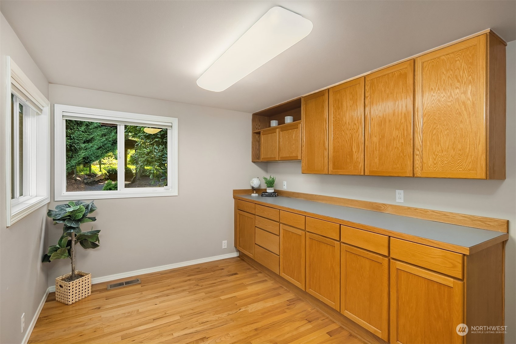 11302 East Riverside Drive Bothell, WA 98011 - Photo 25 of 37 a view of a kitchen with wooden floor and an empty space