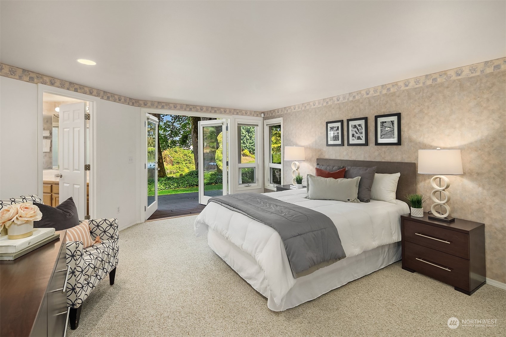 11302 East Riverside Drive Bothell, WA 98011 - Photo 26 of 37 a spacious bedroom with a bed and a couch
