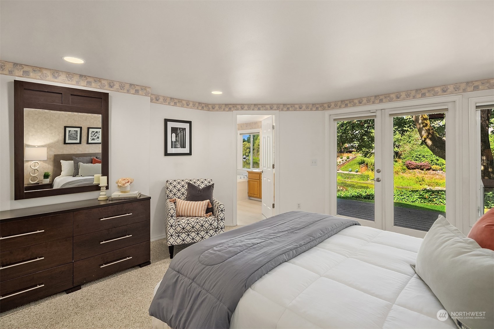 11302 East Riverside Drive Bothell, WA 98011 - Photo 27 of 37 a bedroom with a bed and a dresser