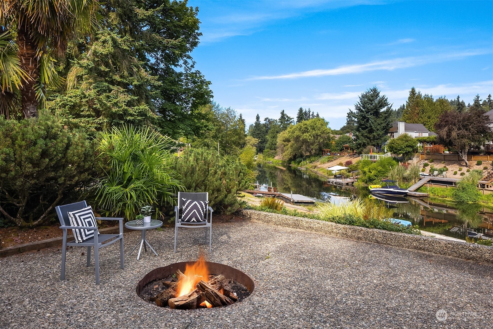 11302 East Riverside Drive Bothell, WA 98011 - Photo 31 of 37 a view of a swimming pool with a patio and a yard