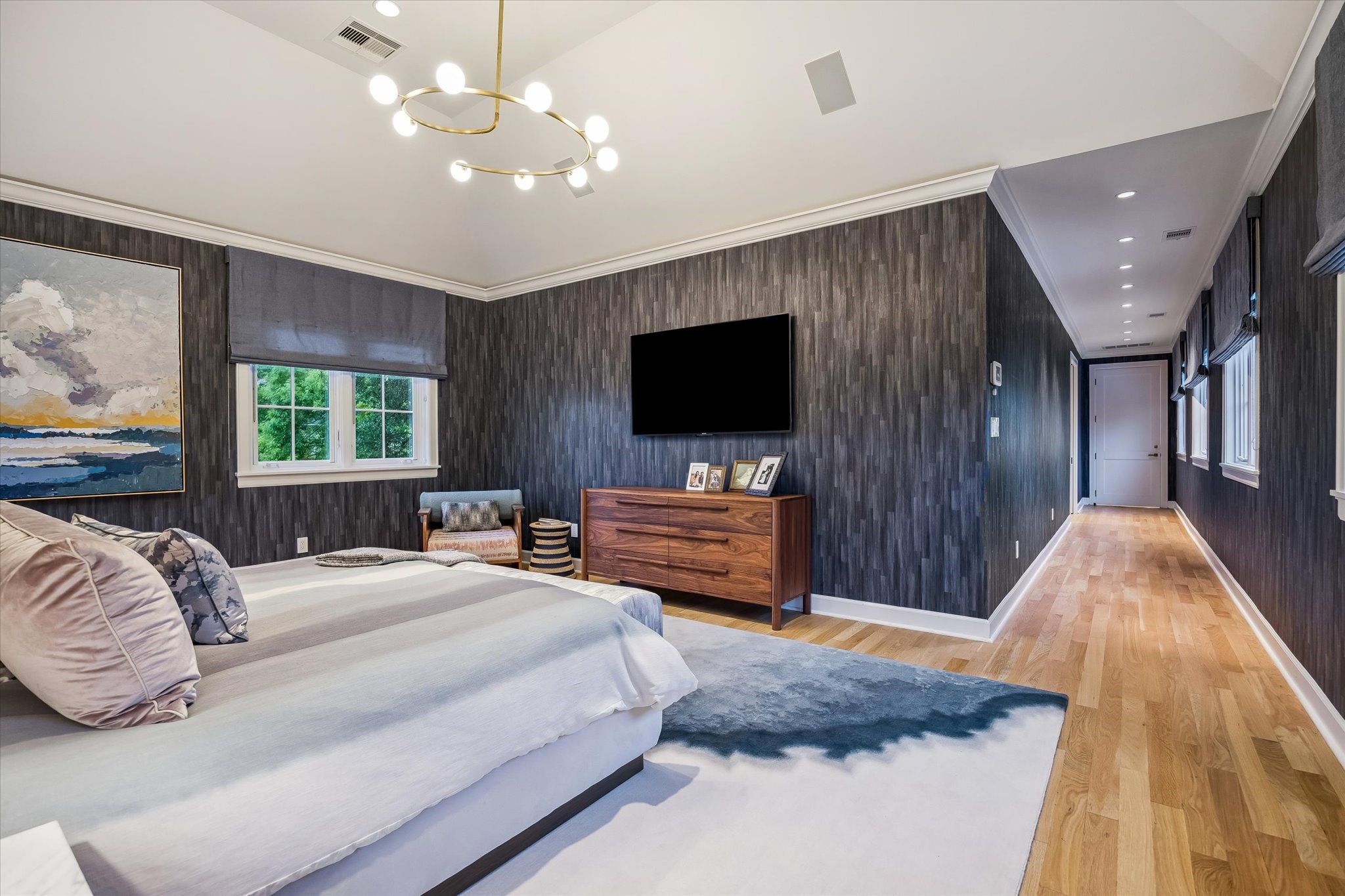 3706 Tangley Street Houston, TX 77005 - Photo 27 of 50 Thoughtfully proportioned, the primary bedroom offers a calm and private retreat within the home. Natural flow leads seamlessly into the en-suite bath, reinforcing a true suite experience. It’s designed for both comfort and understated sophistication.