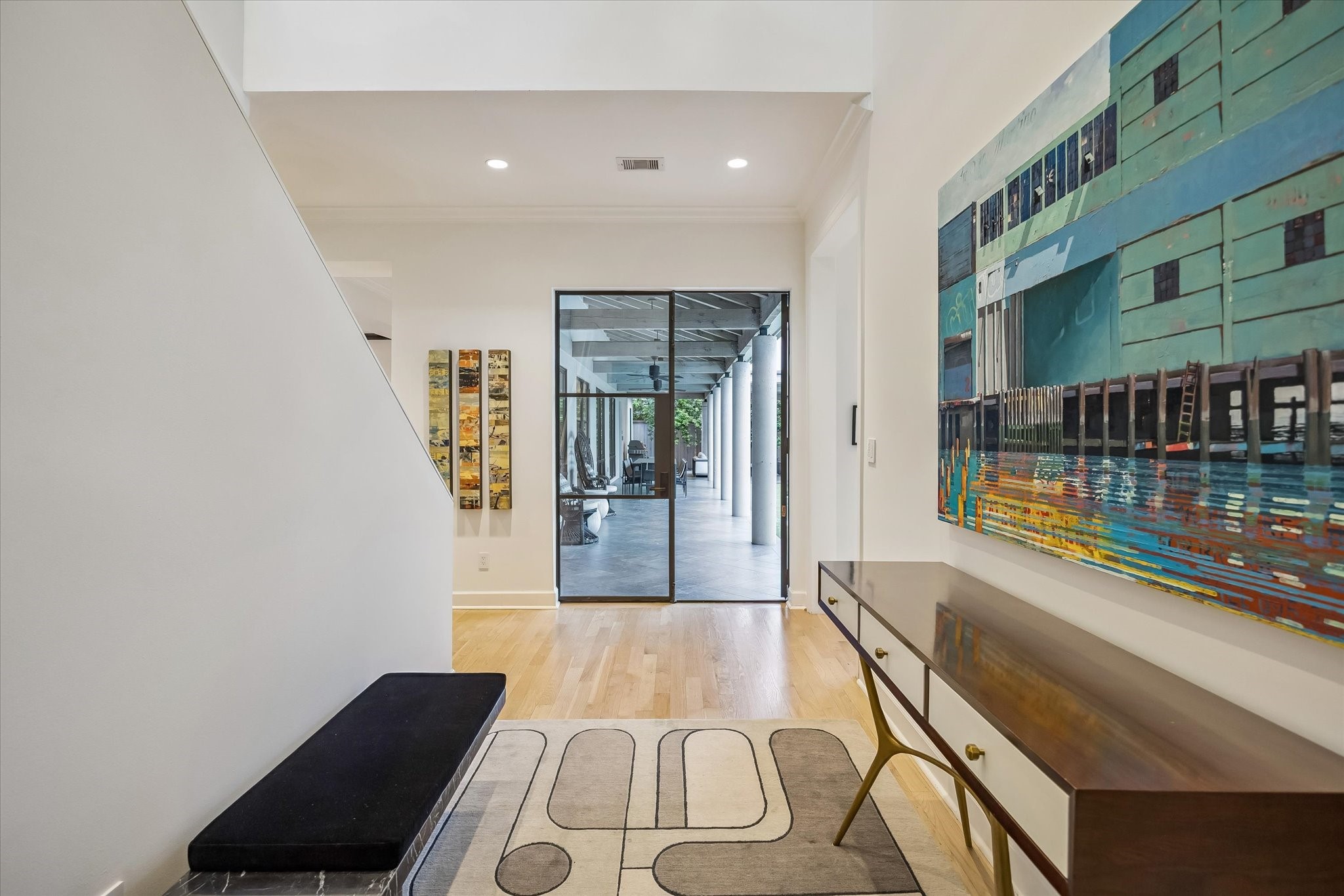 3706 Tangley Street Houston, TX 77005 - Photo 4 of 50 The foyer unfolds with a sense of openness and light, introducing the home’s refined palette and thoughtful design. Clean lines and curated finishes create a calm, sophisticated welcome. It’s a space that immediately feels intentional and elevated.
