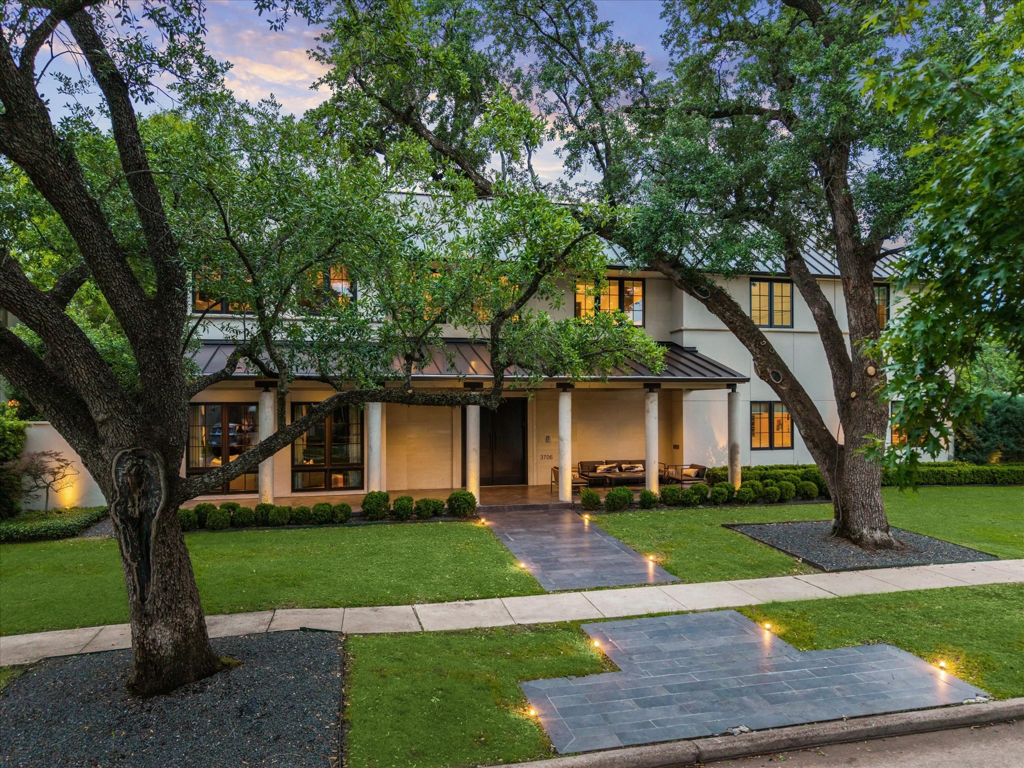 3706 Tangley Street Houston, TX 77005 - Photo 50 of 50 A striking front elevation framed by mature landscaping and timeless architectural detail defines this West University residence. The clean lines and balanced façade reflect thoughtful design and scale. A covered entry creates a welcoming first impression rooted in understated elegance.