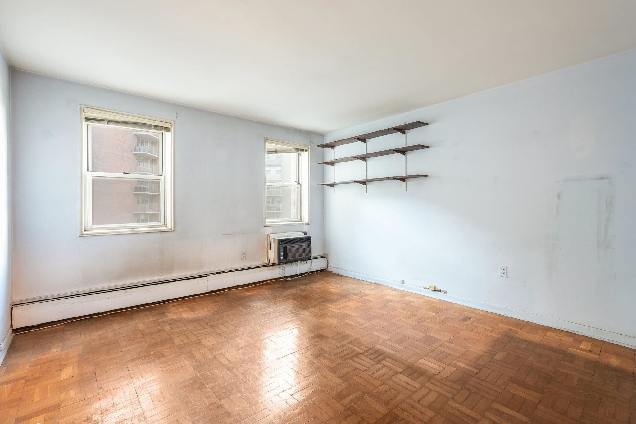 6010 Boulevard East, Unit 54 West New York, NJ 07093 - Photo 12 of 20 an empty room with windows