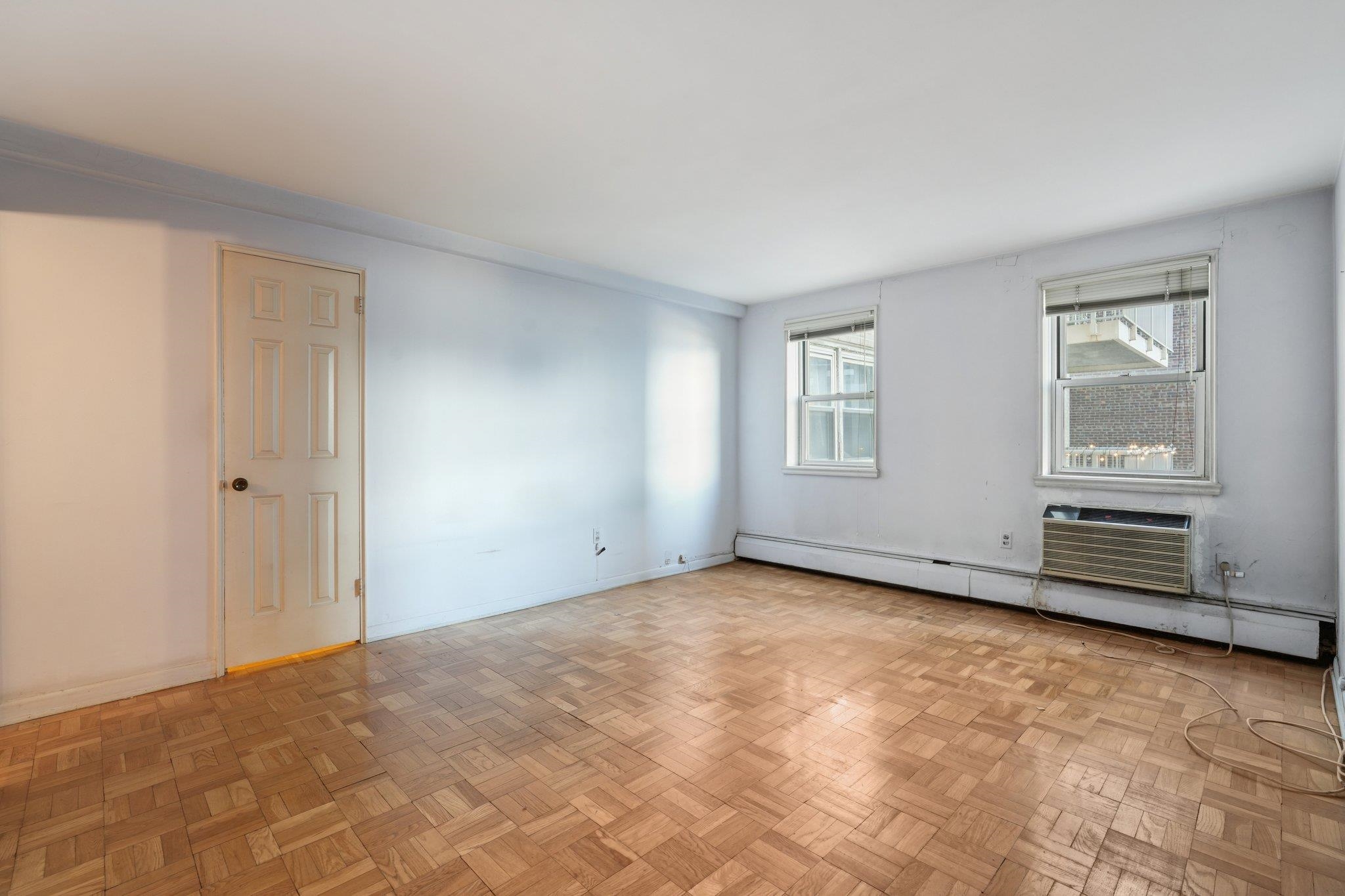 6010 Boulevard East, Unit 54 West New York, NJ 07093 - Photo 16 of 20 a view of an empty room with windows