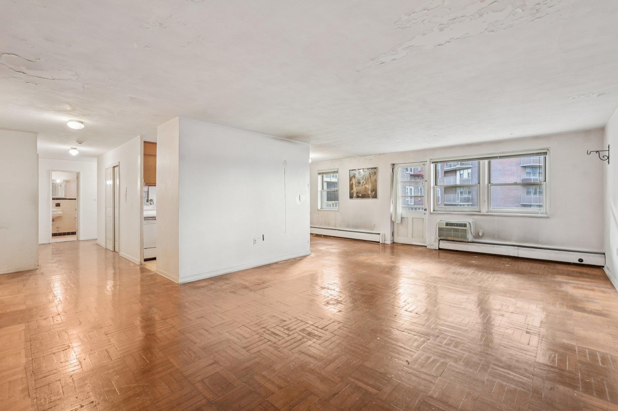 6010 Boulevard East, Unit 54 West New York, NJ 07093 - Photo 5 of 20 a view of a livingroom with wooden floor and kitchen space