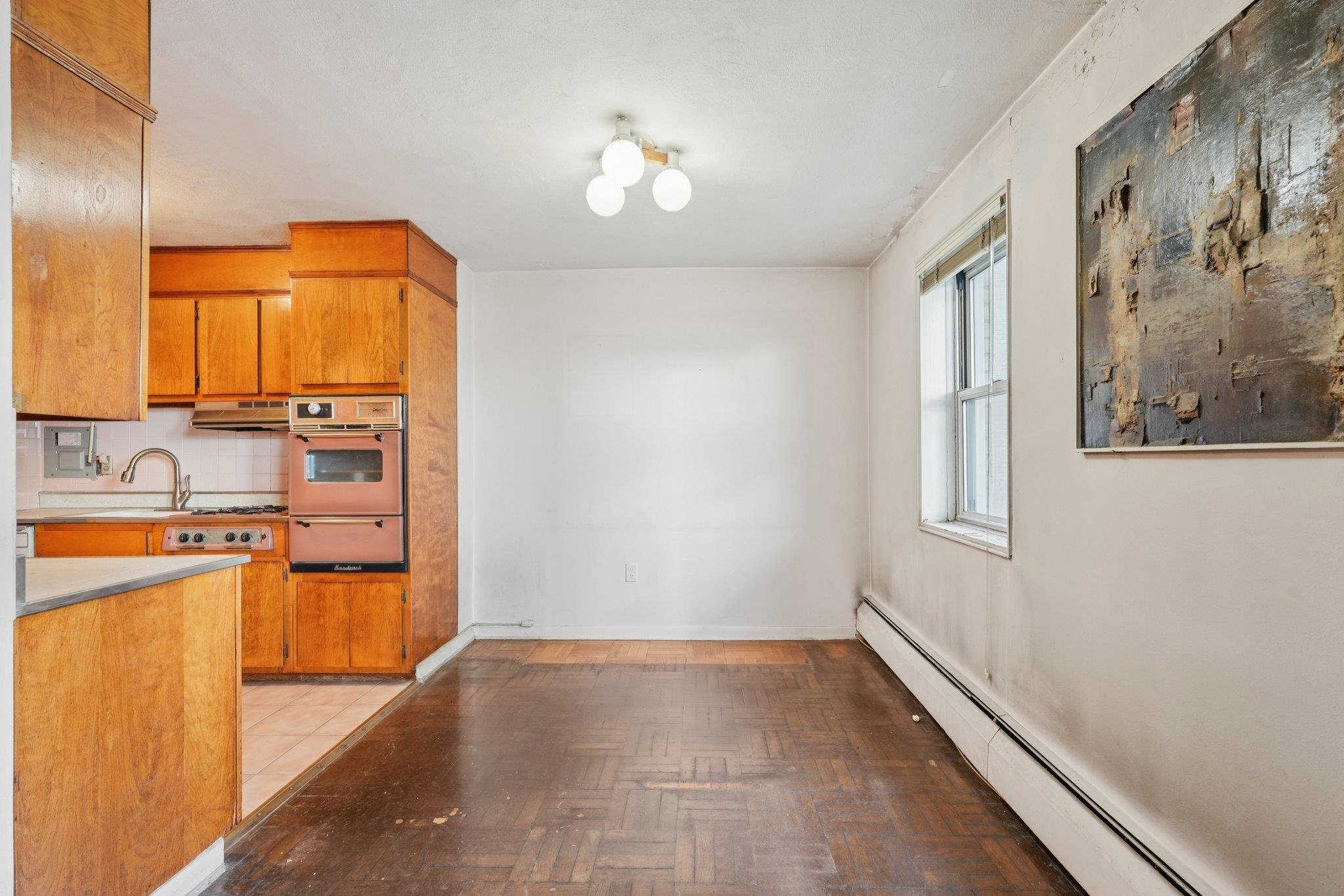 6010 Boulevard East, Unit 54 West New York, NJ 07093 - Photo 10 of 20 a view of a kitchen with a sink and a window