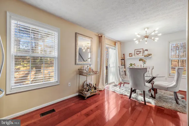 a view of a livingroom with furniture and a window