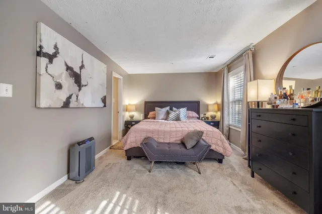 a bedroom with a bed and a cabinets