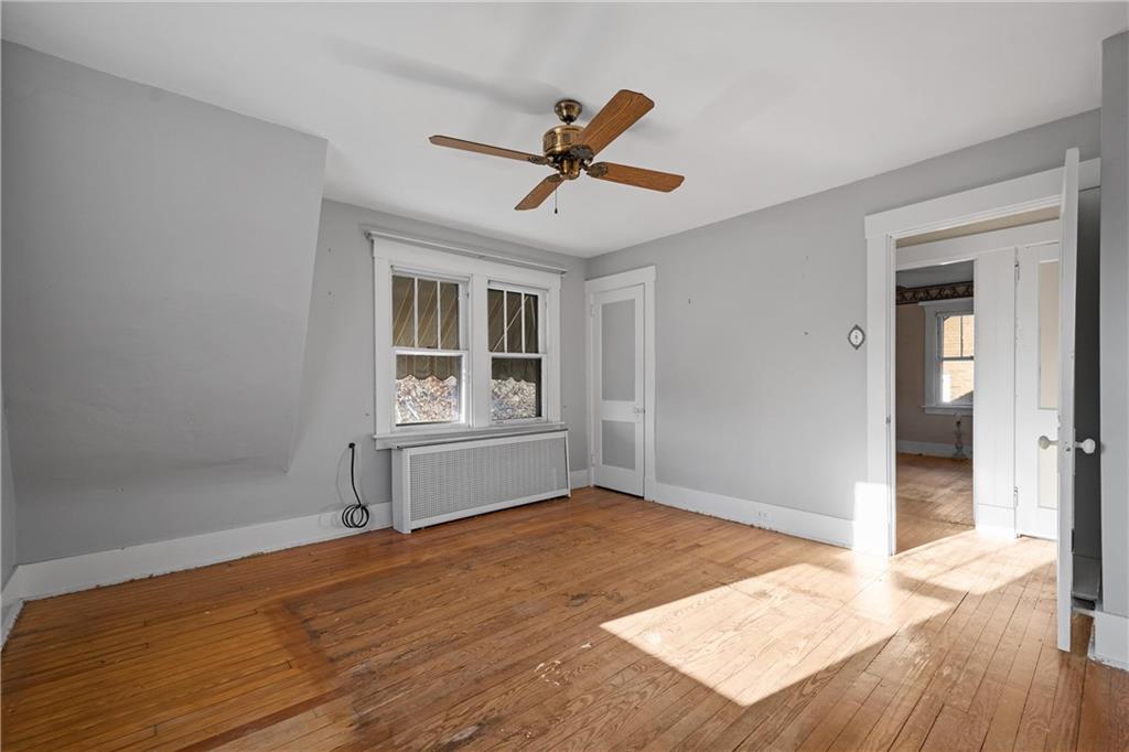 4004 Kleber Street Pittsburgh, PA 15212 - Photo 16 of 35 a view of empty room with wooden floor and fan