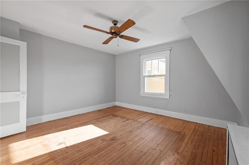 4004 Kleber Street Pittsburgh, PA 15212 - Photo 17 of 35 a view of empty room with wooden floor and fan