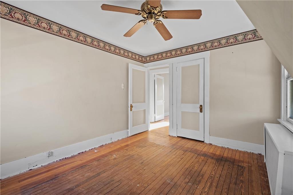 4004 Kleber Street Pittsburgh, PA 15212 - Photo 22 of 35 a view of a hallway with wooden floor