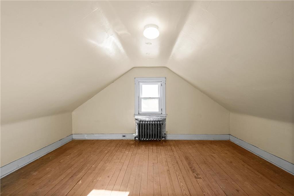 4004 Kleber Street Pittsburgh, PA 15212 - Photo 24 of 35 an empty room with wooden floor and windows