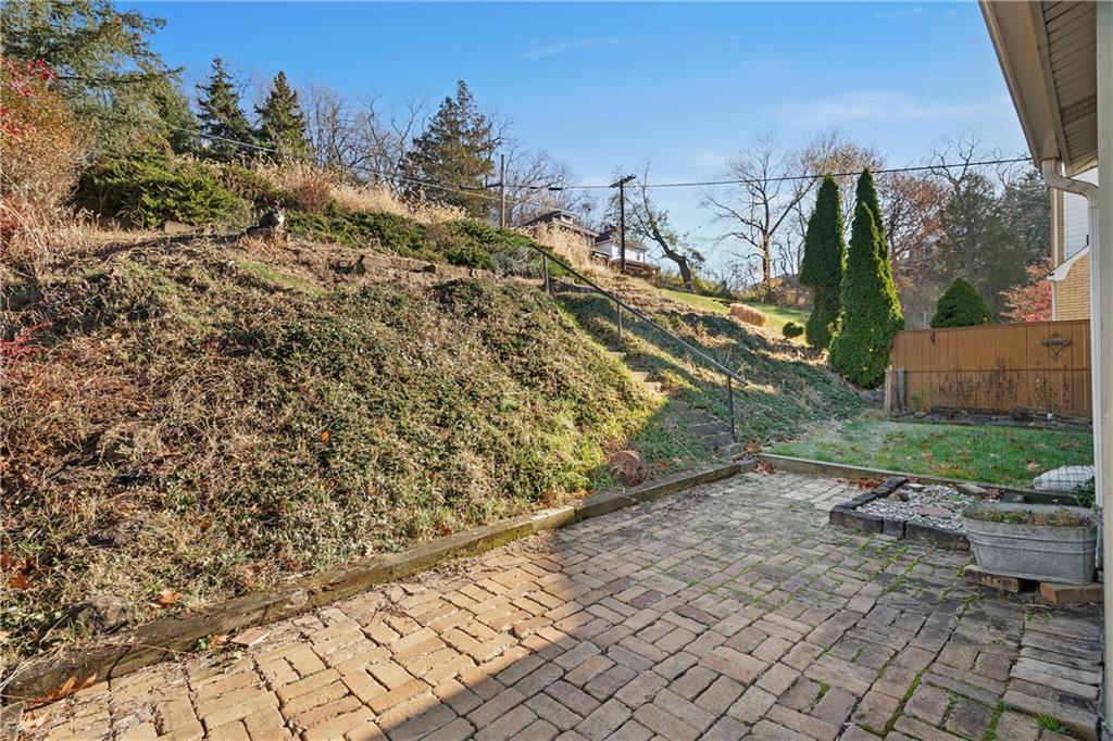 4004 Kleber Street Pittsburgh, PA 15212 - Photo 29 of 35 a view of a yard with plants and wooden fence