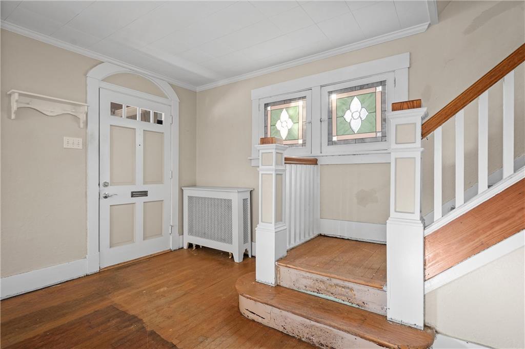 4004 Kleber Street Pittsburgh, PA 15212 - Photo 3 of 35 a view of an entryway with wooden floor and a livingroom