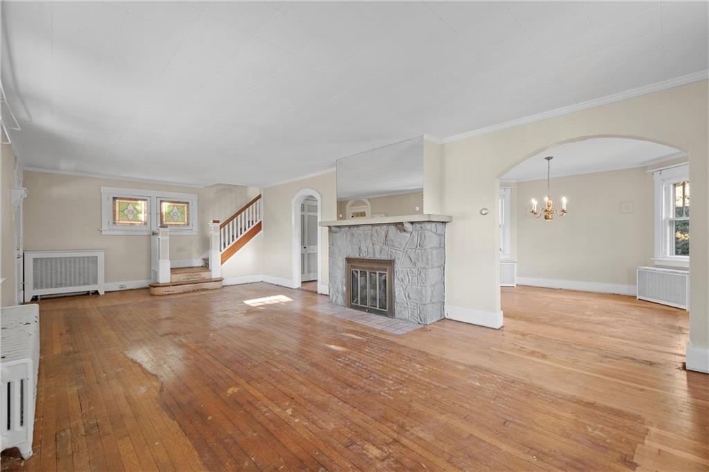 4004 Kleber Street Pittsburgh, PA 15212 - Photo 7 of 35 a view of empty room with wooden floor and fireplace
