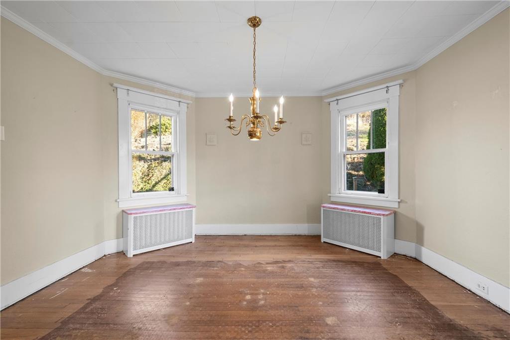 4004 Kleber Street Pittsburgh, PA 15212 - Photo 8 of 35 an empty room with windows and entrance