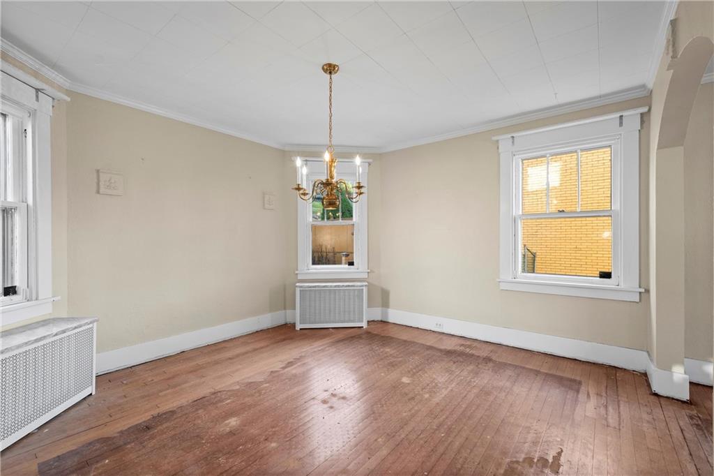 4004 Kleber Street Pittsburgh, PA 15212 - Photo 9 of 35 a view of an empty room with window and wooden floor