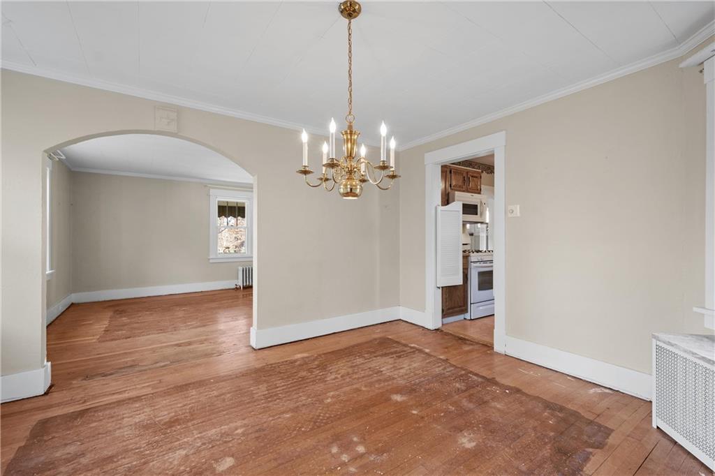 4004 Kleber Street Pittsburgh, PA 15212 - Photo 10 of 35 a view of a livingroom with a chandelier wooden floor and a chandelier