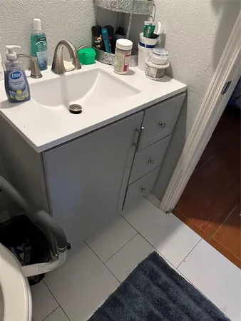 a kitchen with a sink and a stove