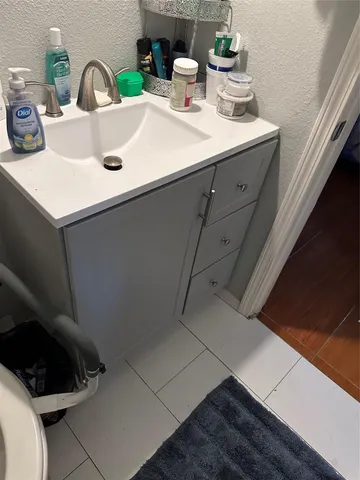 a kitchen with a sink and a stove