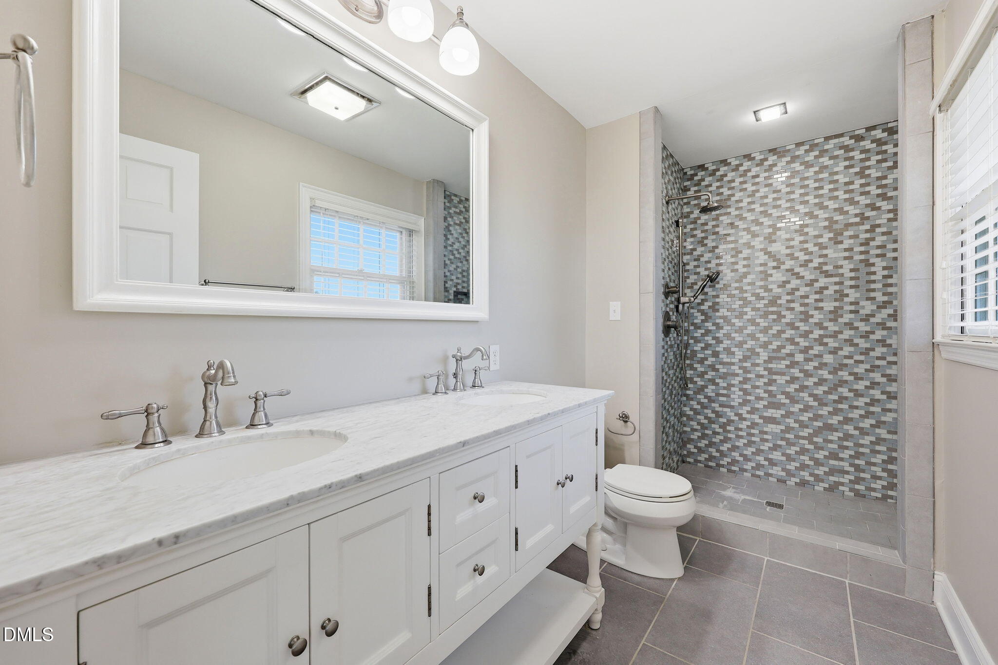 1130 Prospect Church Road Dunn, NC 28334 - Photo 35 of 47 a bathroom with a double vanity sink toilet and shower