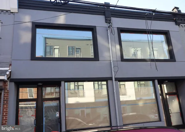 a front view of a house with large windows