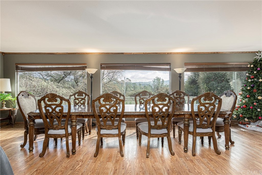 45943 Black Oak Road Coarsegold, CA 93614 - Photo 17 of 64 a view of a dining room with furniture window and wooden floor