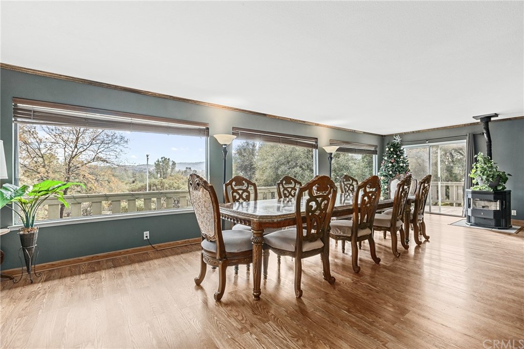 45943 Black Oak Road Coarsegold, CA 93614 - Photo 18 of 64 a dining room with furniture window and wooden floor