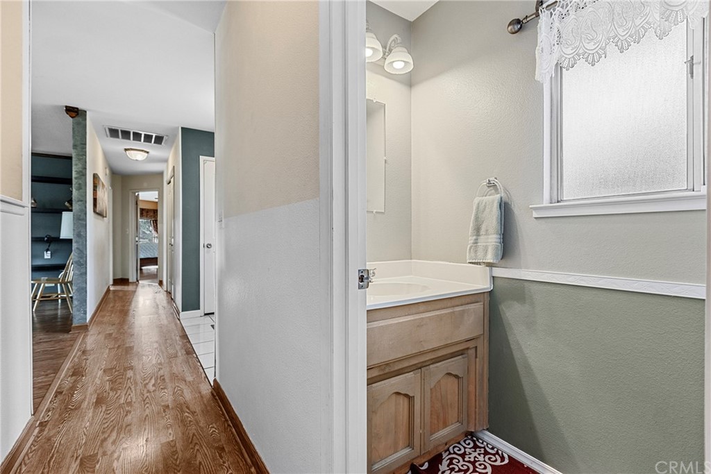 45943 Black Oak Road Coarsegold, CA 93614 - Photo 28 of 64 a view of a hallway with a washer and dryer
