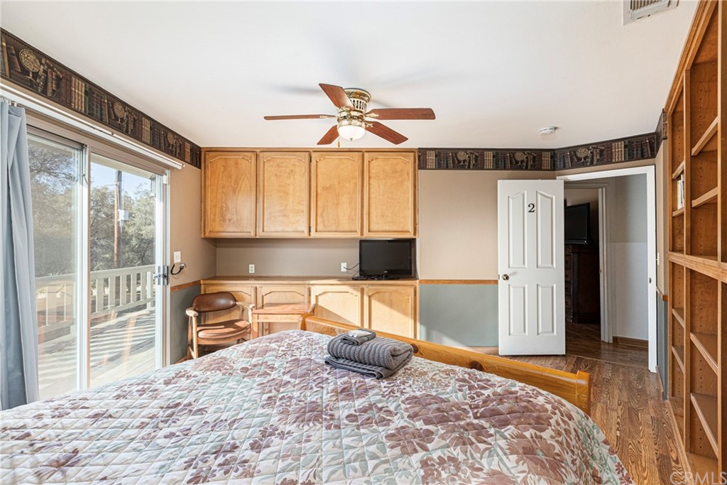 45943 Black Oak Road Coarsegold, CA 93614 - Photo 36 of 64 a bedroom with a bed and a large window