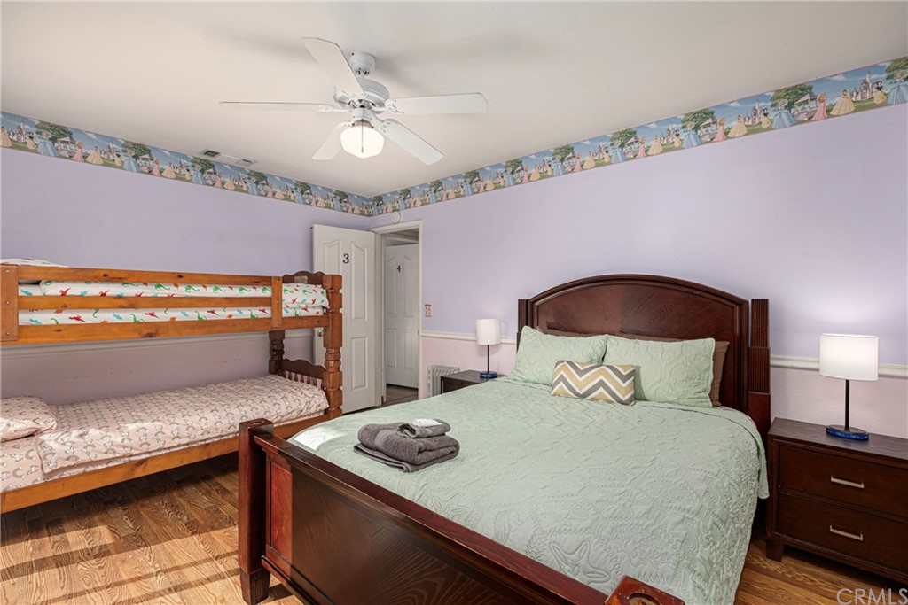 45943 Black Oak Road Coarsegold, CA 93614 - Photo 41 of 64 a bedroom with a bed and a ceiling fan