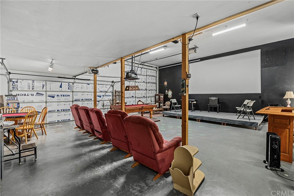 45943 Black Oak Road Coarsegold, CA 93614 - Photo 48 of 64 a living room with furniture a rug and white walls