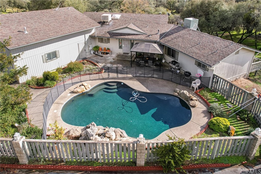 45943 Black Oak Road Coarsegold, CA 93614 - Photo 5 of 64 an aerial view of a house with garden space and outdoor seating