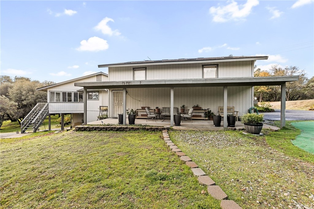 45943 Black Oak Road Coarsegold, CA 93614 - Photo 56 of 64 a view of a house with pool porch and chairs
