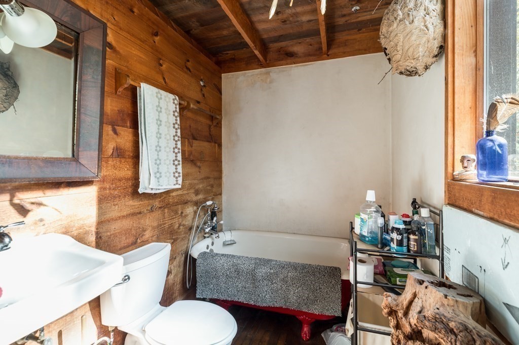 24 Paradise Road Ipswich, MA 01938 - Photo 11 of 27 a bathroom with a sink mirror vanity and toilet