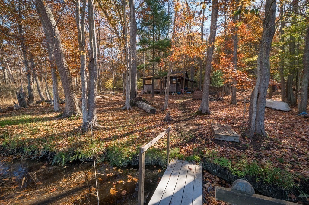24 Paradise Road Ipswich, MA 01938 - Photo 15 of 27 a view of a yard with plants and trees