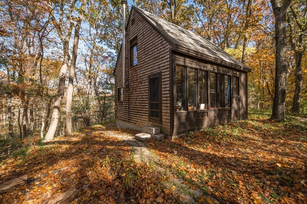 24 Paradise Road Ipswich, MA 01938 - Photo 2 of 27 a view of a house with backyard and trees